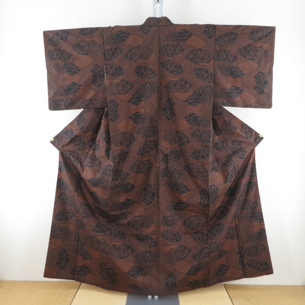 紬 着物 大島紬 扇子模様 黒色xオレンジ色 袷 バチ衿 絹 仕立て上がり