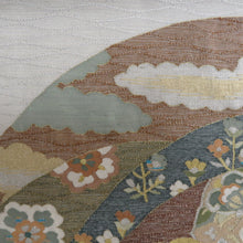 Load image into Gallery viewer, 袋帯 白色x銀色ｘ金色ｘ多色 カラフル 織文様 波に雲取りと華文様 お太鼓柄 金糸銀糸 パールトーン加工済 正絹 礼装 フォーマル 着物帯 長さ448cm