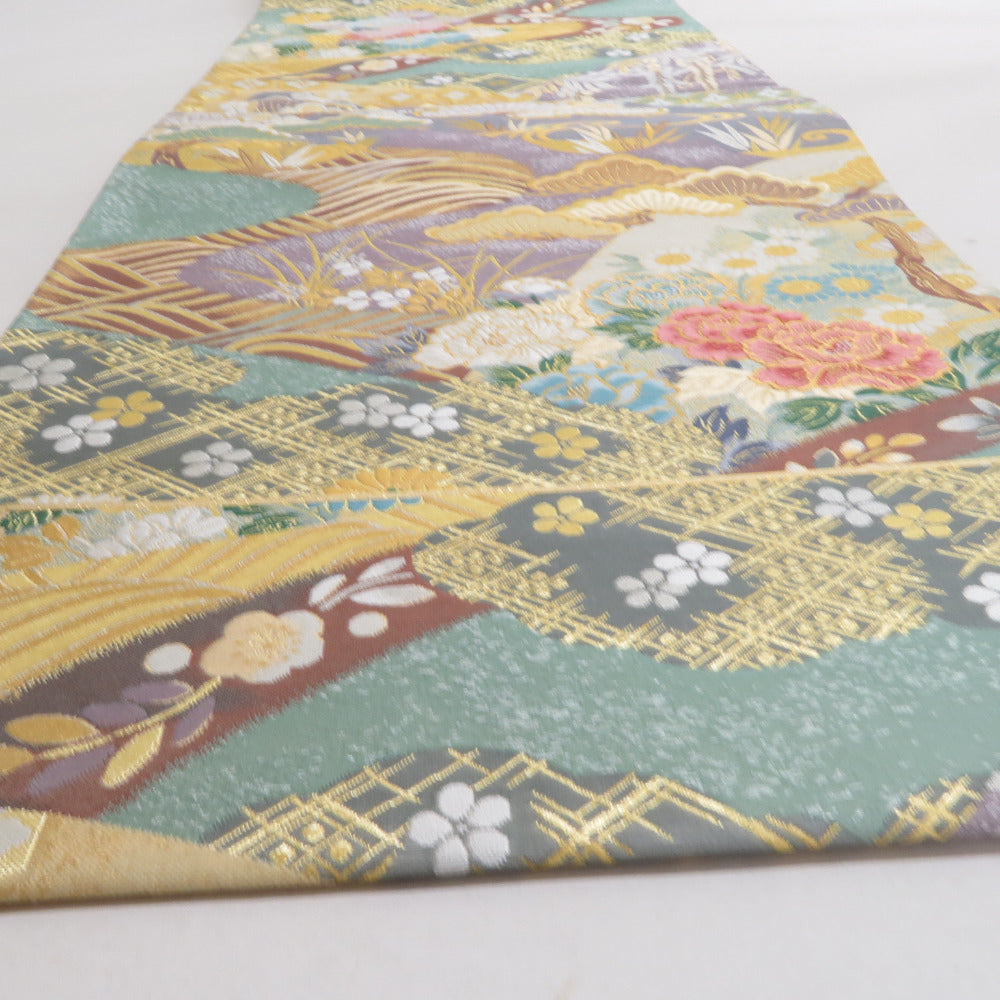 袋帯 正絹 パステル系 螺鈿入り 緑色x紫色x金色 流水に切嵌の吉祥