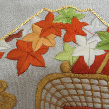 Load image into Gallery viewer, 名古屋帯 つづれ 銀色ｘ金色ｘオレンジ色ｘ多色 銀糸金糸 御所車文様 刺繍入り お太鼓柄 正絹 カジュアル 仕立て上がり 着物帯 長さ336cm