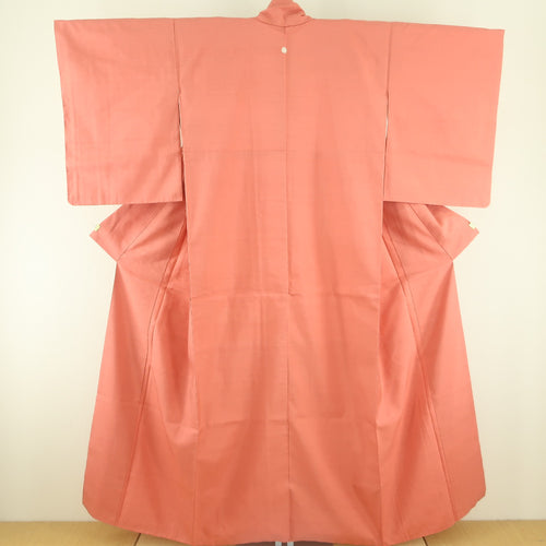 色無地 紬地 一つ紋 抱き柏紋 袷 広衿 赤橙色 正絹 仕立て上がり着物 身丈158cm 中古